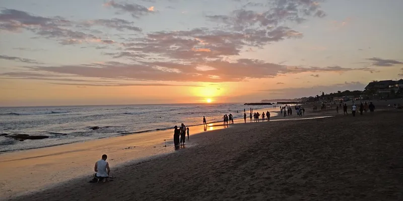 Sunset over Batu Bolong, Canggu, with the tide out