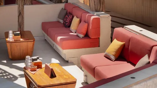 Backstage sofas beside the DJ booth at Zumana Beach Club