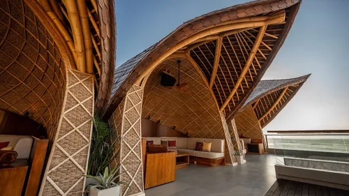A woven-bamboo cabana at Zumana Beach Club, Kuta