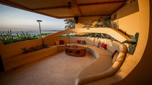 The Grotto VIP sofa at Zumana Beach Club in evening light