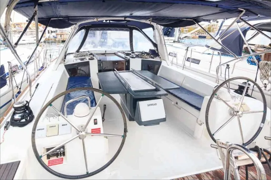 Helm and cockpit of a skippered charter sailboat