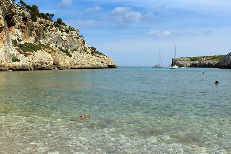 The narrow limestone inlet of Cala Magraner near Manacor, boats moored at its mouth