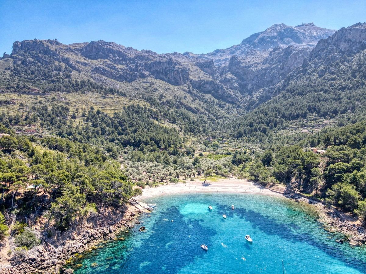 Cala Tuent seen from above, turquoise water below the Serra de Tramuntana