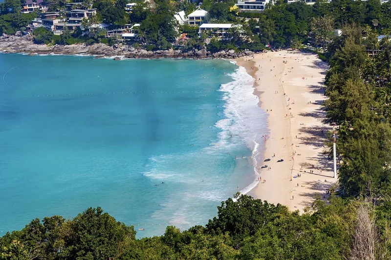 Kata Noi from the hill above &mdash; the whole bay, resorts at the north end