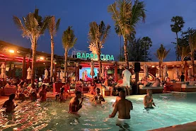 The pool at Barra Cuda Beach Club, Patong, lit up at night